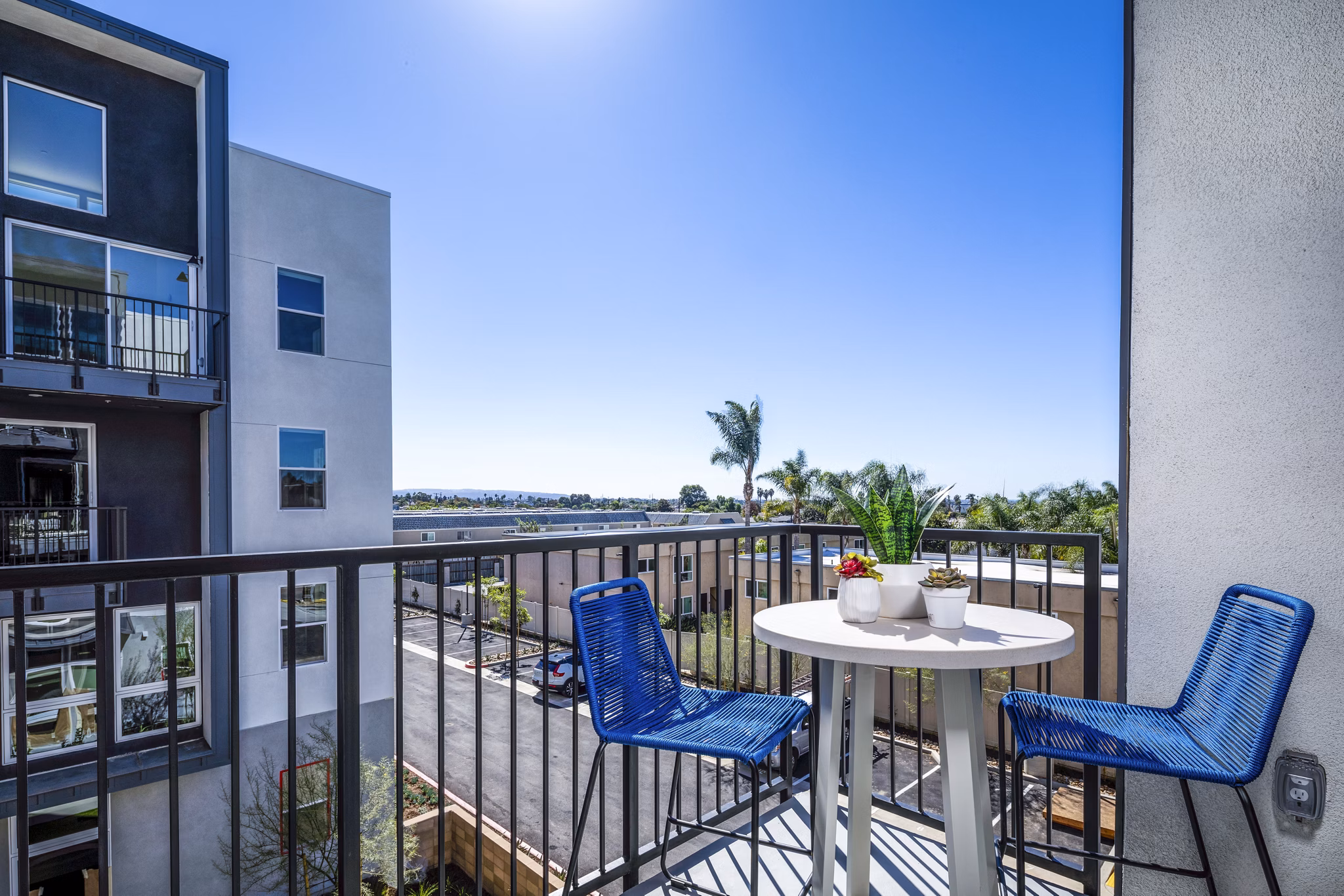 Charming patio with stylish seating at Azul Chula Vista Apartments, ideal for relaxation and outdoor dining