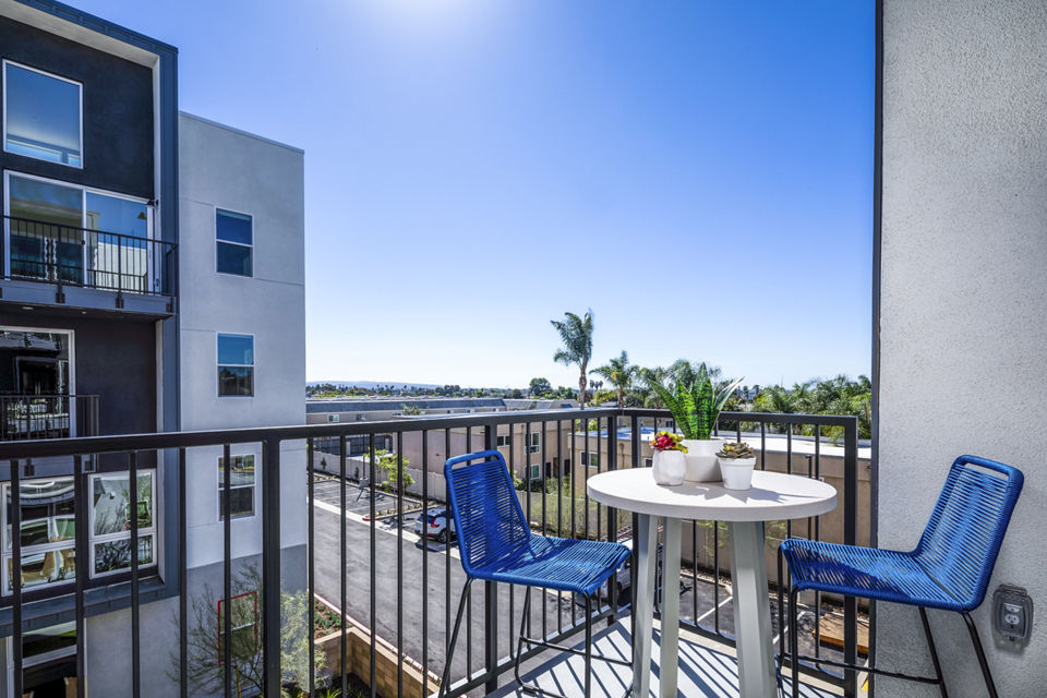 Charming patio with stylish seating at Azul Chula Vista Apartments, ideal for relaxation and outdoor dining