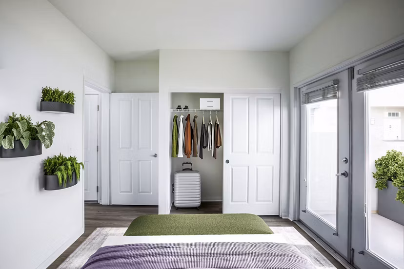 Cozy bedroom with elegant decor at The Heritage Apartments, offering luxury living in the Greystar community