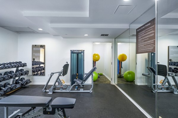 Modern fitness center with state-of-the-art equipment at Gema Apartments luxury living