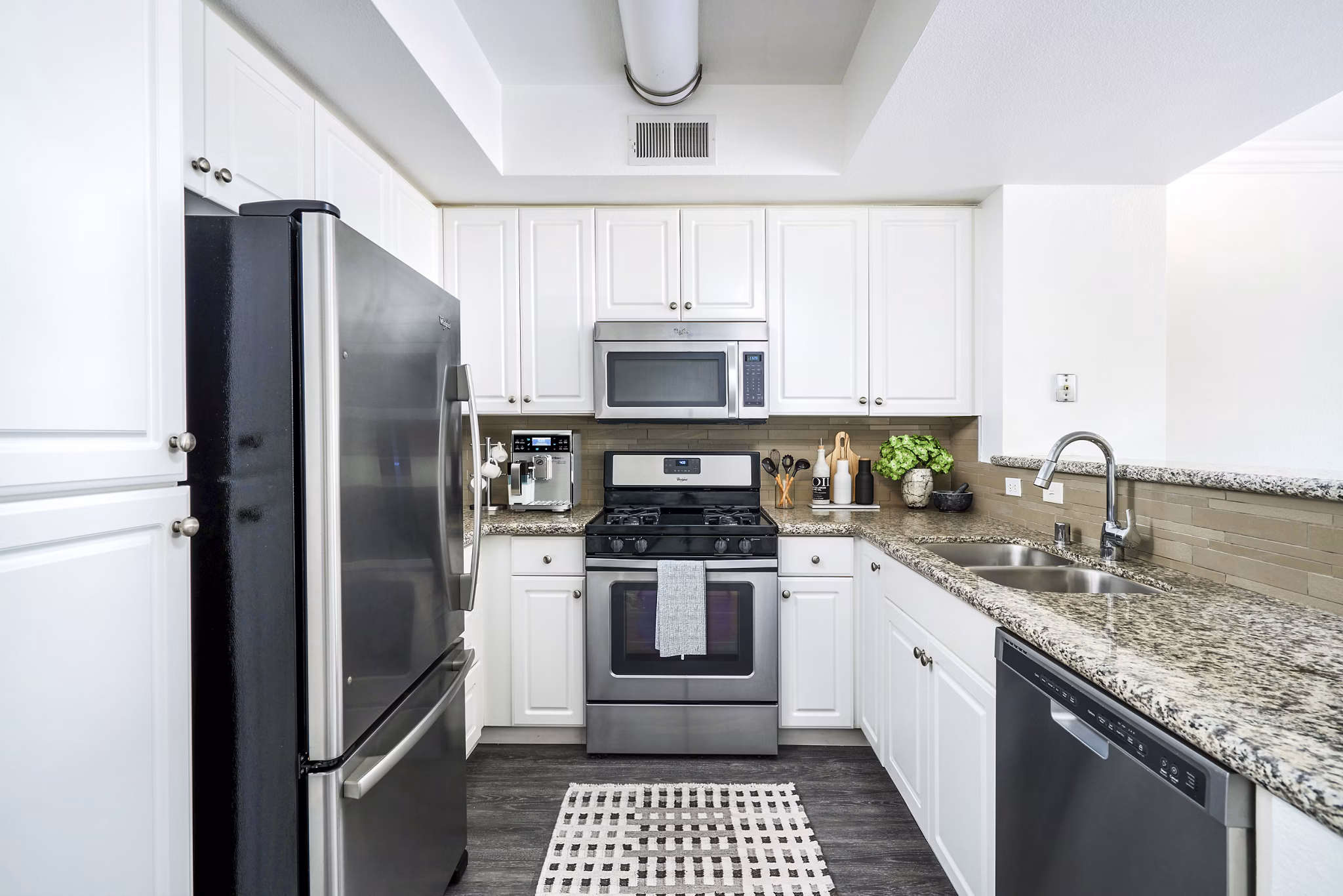 Gema Apartments: Modern kitchen with stainless steel appliances and granite countertops