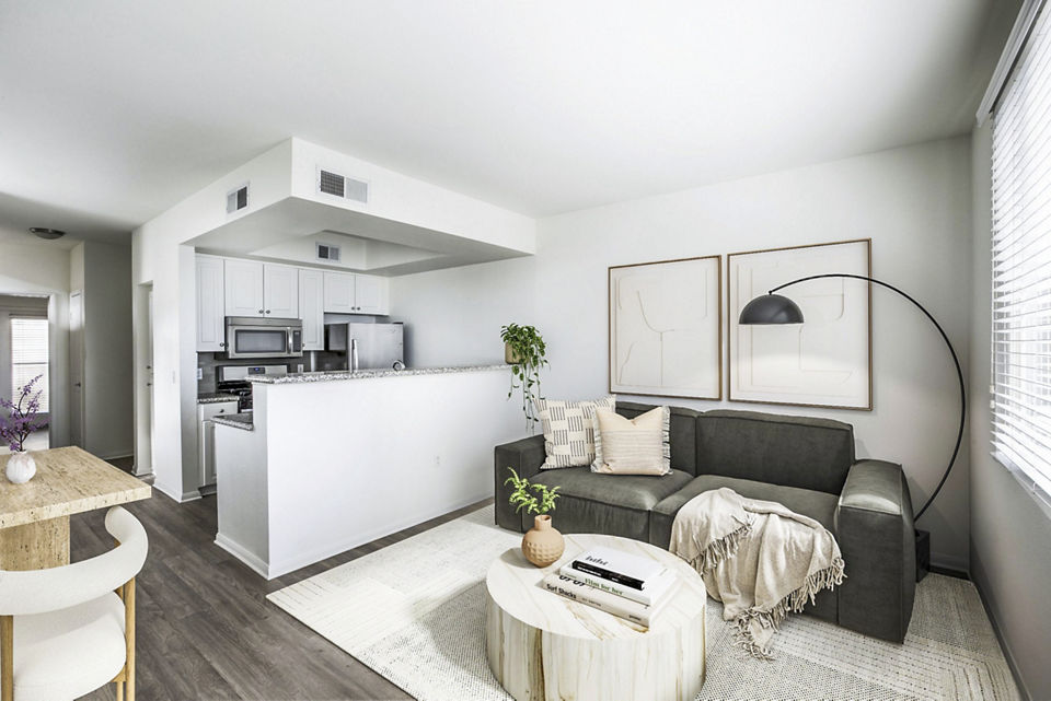 Open-concept living and dining room with contemporary furnishings at The Heritage Apartments