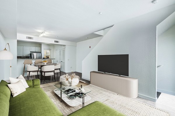Modern living room with stylish furniture and large windows at Gema Apartments
