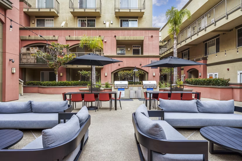 Grill patio with outdoor seating at Gema Apartments, perfect for entertaining and dining al fresco