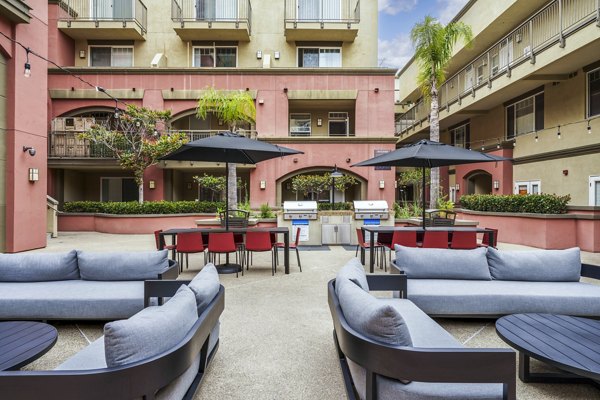 Grill patio with outdoor seating at Gema Apartments, perfect for entertaining and dining al fresco