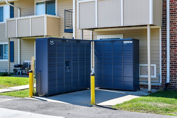 Mail room with parcel lockers at Sycamore Woods Apartments