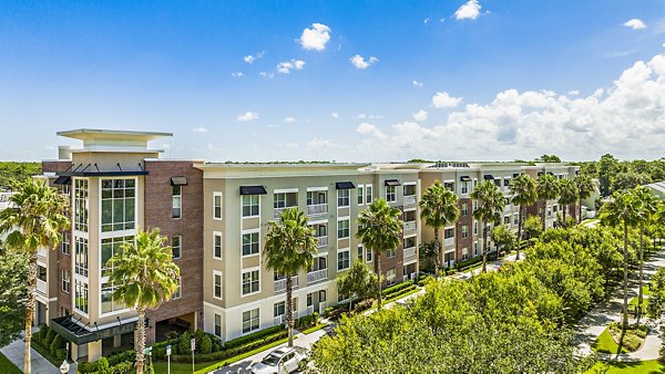 Parkside at Avalon Park Apartments: Elegant multi-story building in a scenic woodland setting
