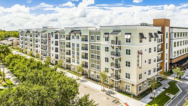 Parkside at Avalon Park: Elegant view of luxury apartment building with landscaped surroundings