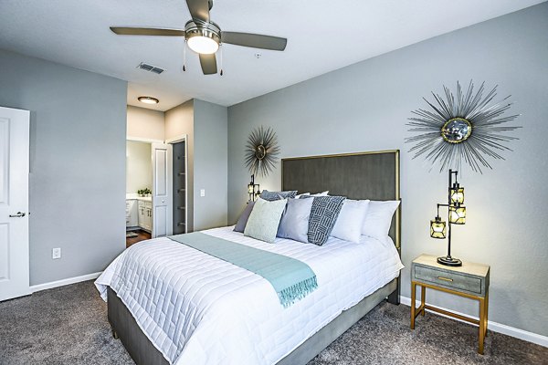 Cozy bedroom with elegant decor at Parkside at Avalon Park Apartments