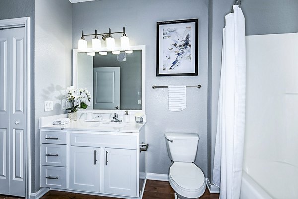 Bathroom featuring modern fixtures and sleek design at Parkside at Avalon Park Apartments, luxury apartments by Greystar