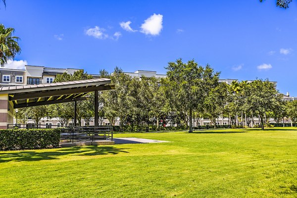 Scenic dog park surrounded by lush greenery at Parkside at Avalon Park Apartments