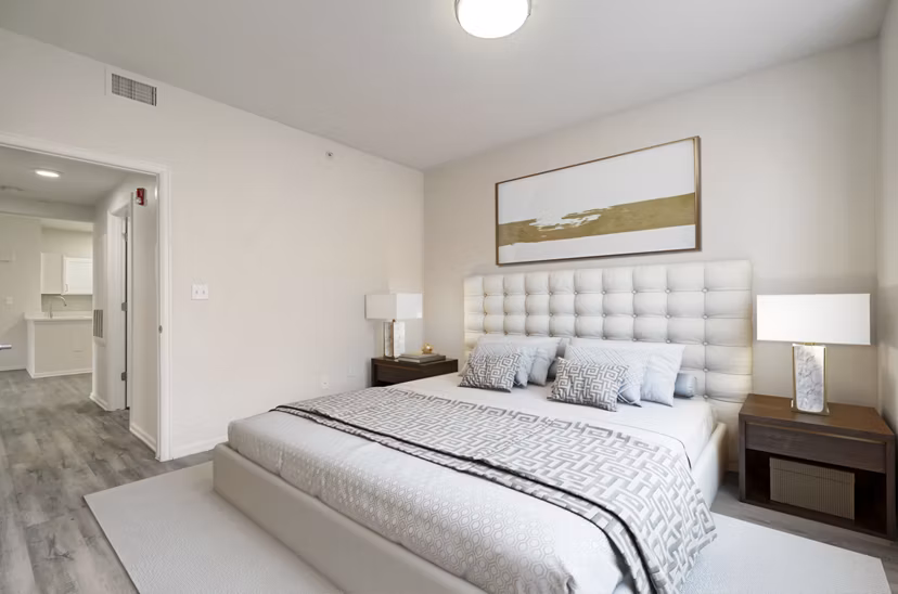 Bedroom featuring elegant design and plush bedding at Links at Legacy Ridge Apartments