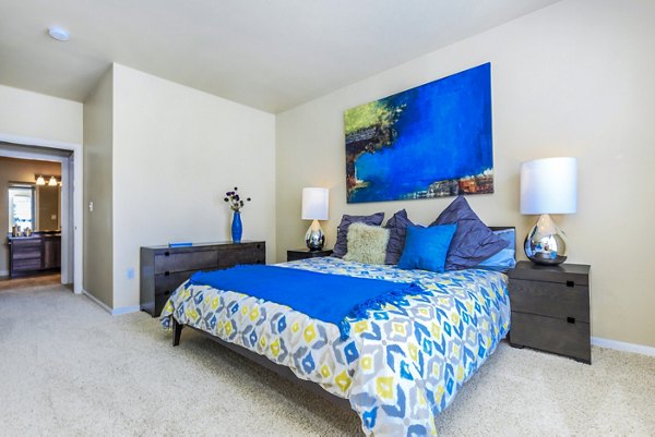 Cozy bedroom with elegant furnishings at Links at Legacy Ridge Apartments
