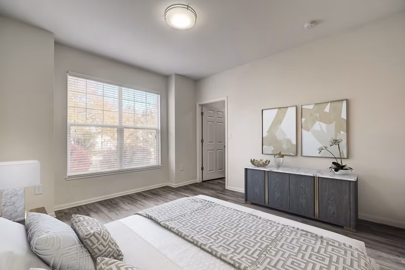 Walk-in closet in a cozy bedroom at Links at Legacy Ridge Apartments, offering ample storage space and convenience for residents
