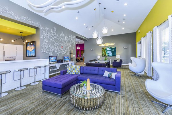 Clubhouse featuring modern design and large seating area at Links at Legacy Ridge Apartments