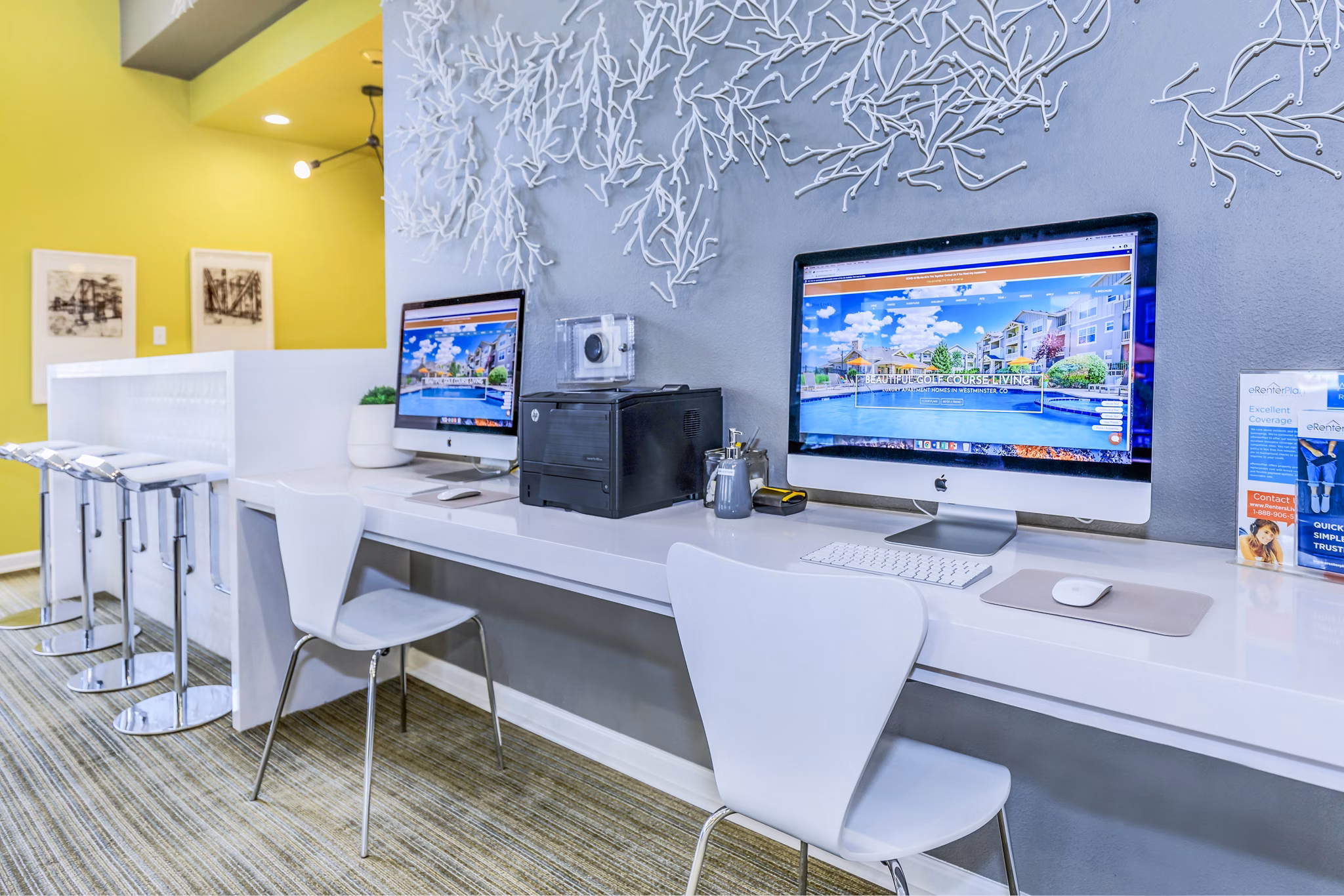 Clubhouse business center with modern workstations at Links at Legacy Ridge Apartments