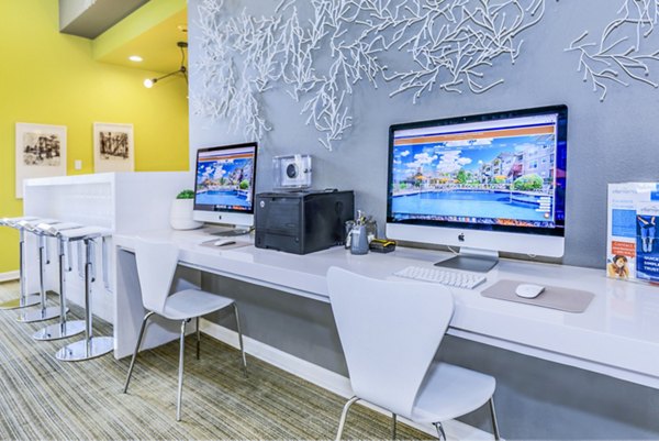 Clubhouse business center with modern workstations at Links at Legacy Ridge Apartments