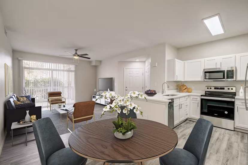 Dining room with elegant lighting and modern furnishings at Links at Legacy Ridge Apartments