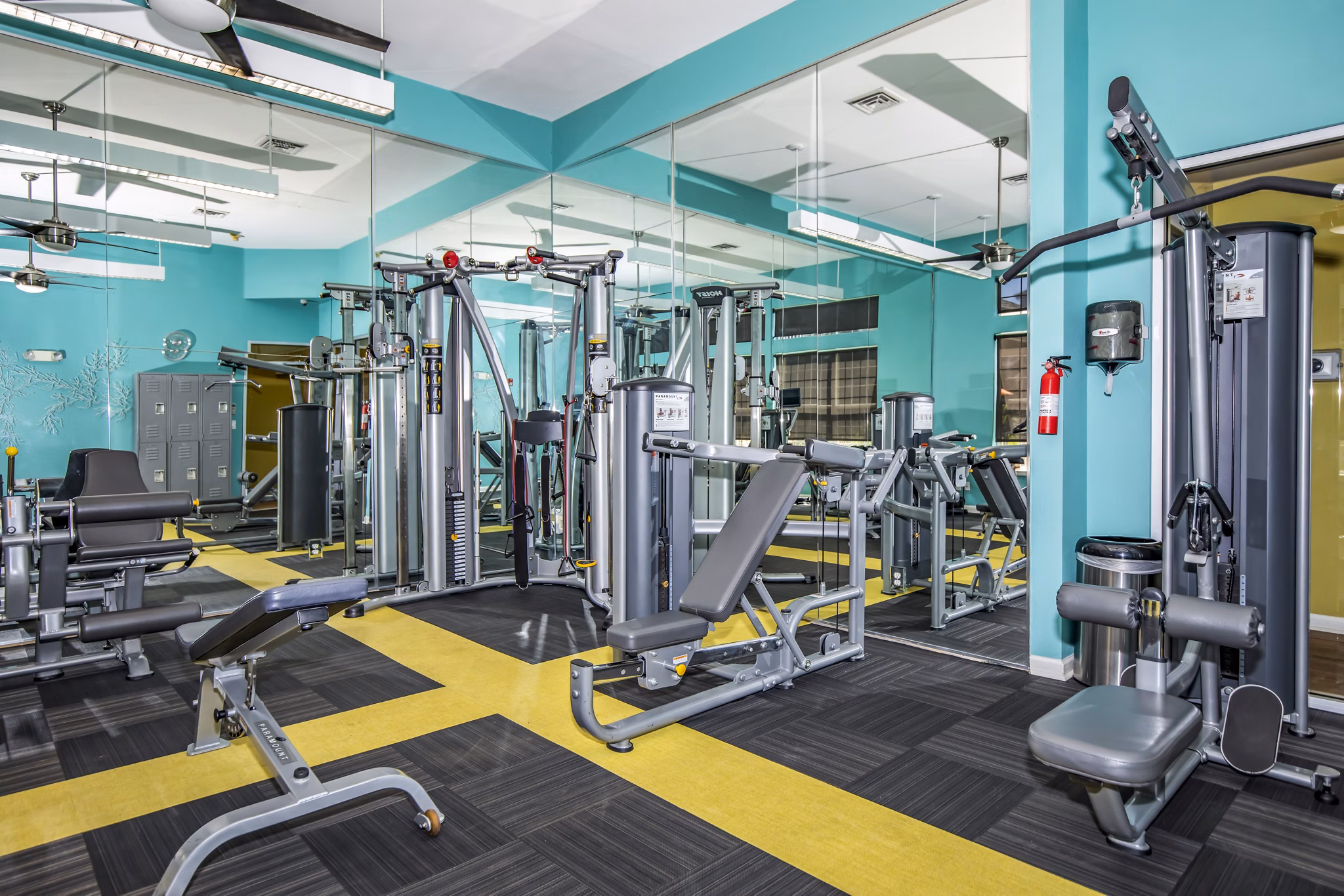 Modern fitness center with cardio and strength equipment at Links at Legacy Ridge Apartments