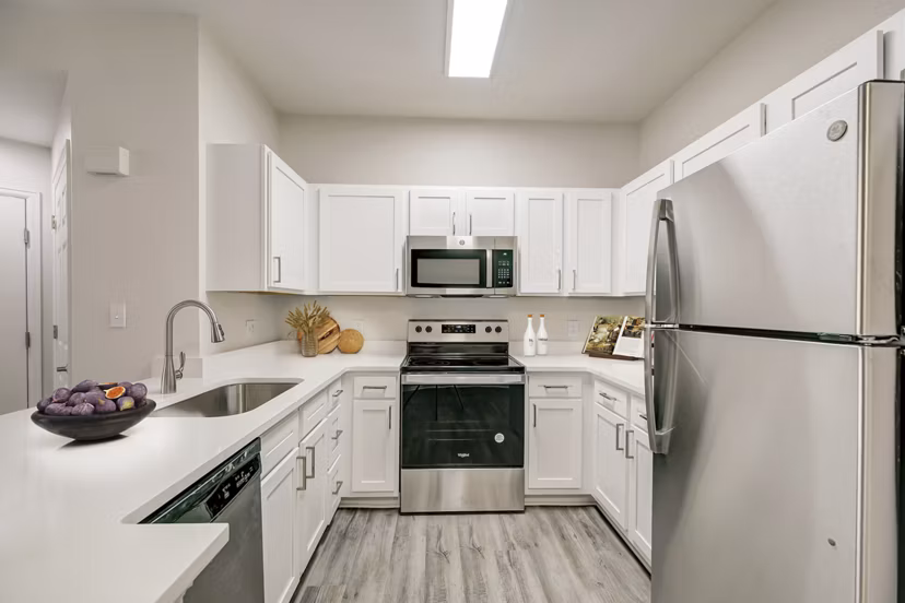 Modern kitchen with stainless steel appliances at Links at Legacy Ridge Apartments