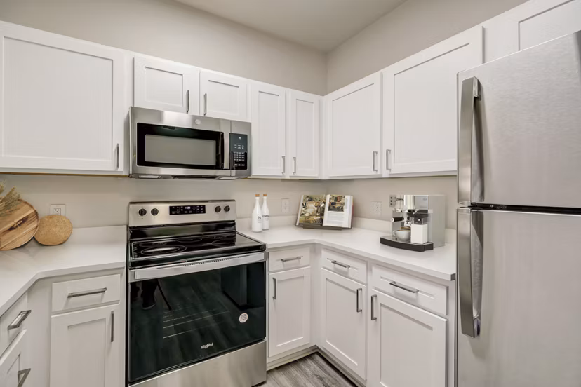 Modern kitchen with stainless steel appliances at Links at Legacy Ridge Apartments