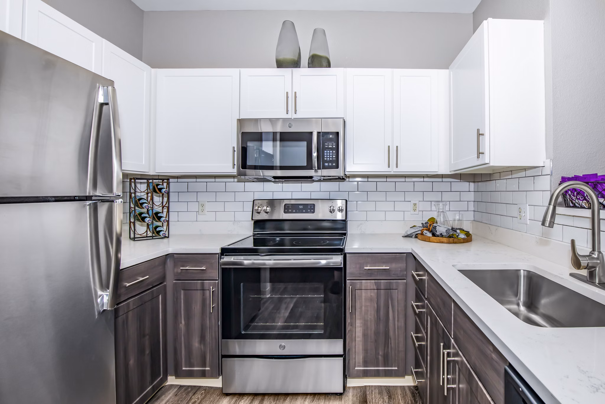 Modern kitchen with stainless steel appliances at Links at Legacy Ridge Apartments