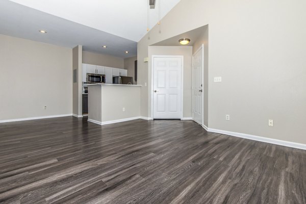 Spacious living room with modern furnishings in Links at Legacy Ridge Apartments