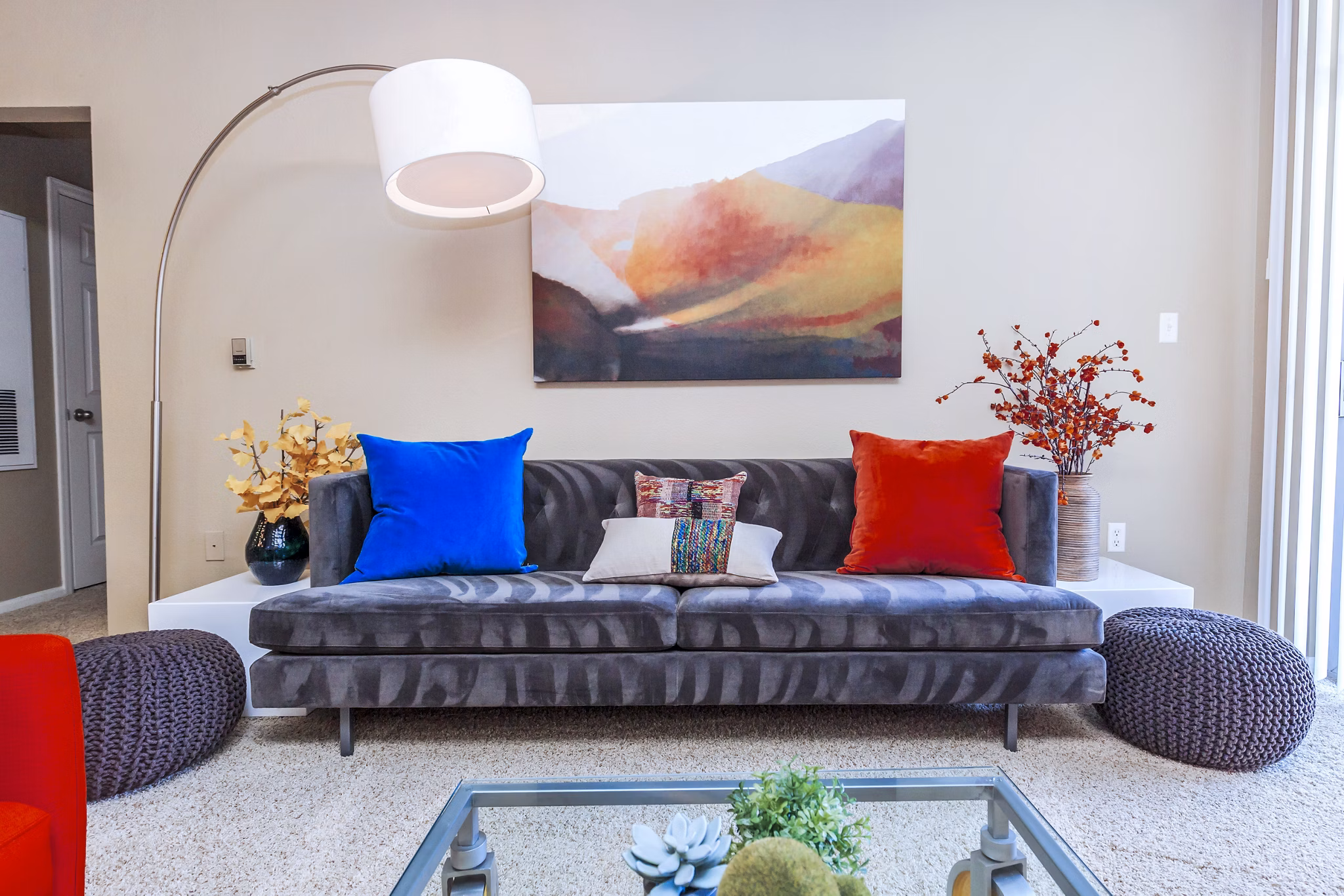 Comfortable living room with plush seating and ample natural light at Links at Legacy Ridge Apartments