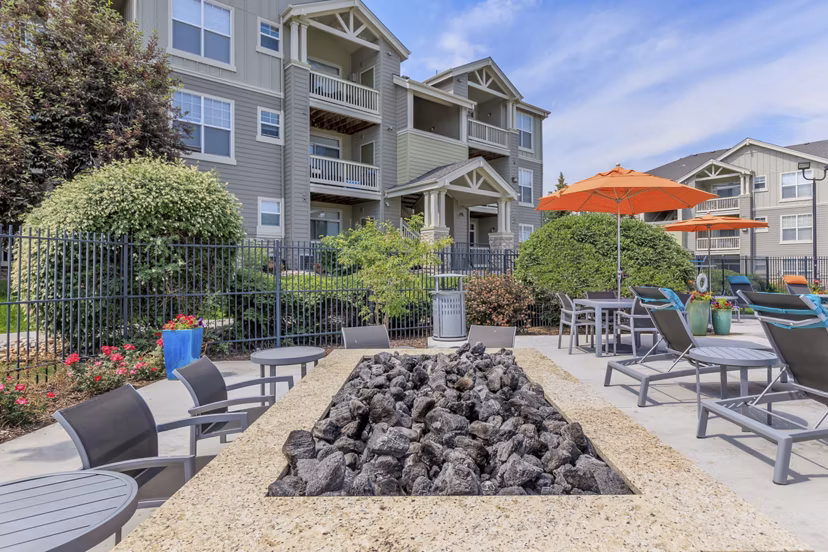 Outdoor grill area at Links at Legacy Ridge Apartments offering communal cooking space and seating