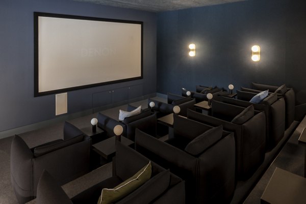 Luxurious private cinema room at Lyons Dock with comfortable seating and a large screen.