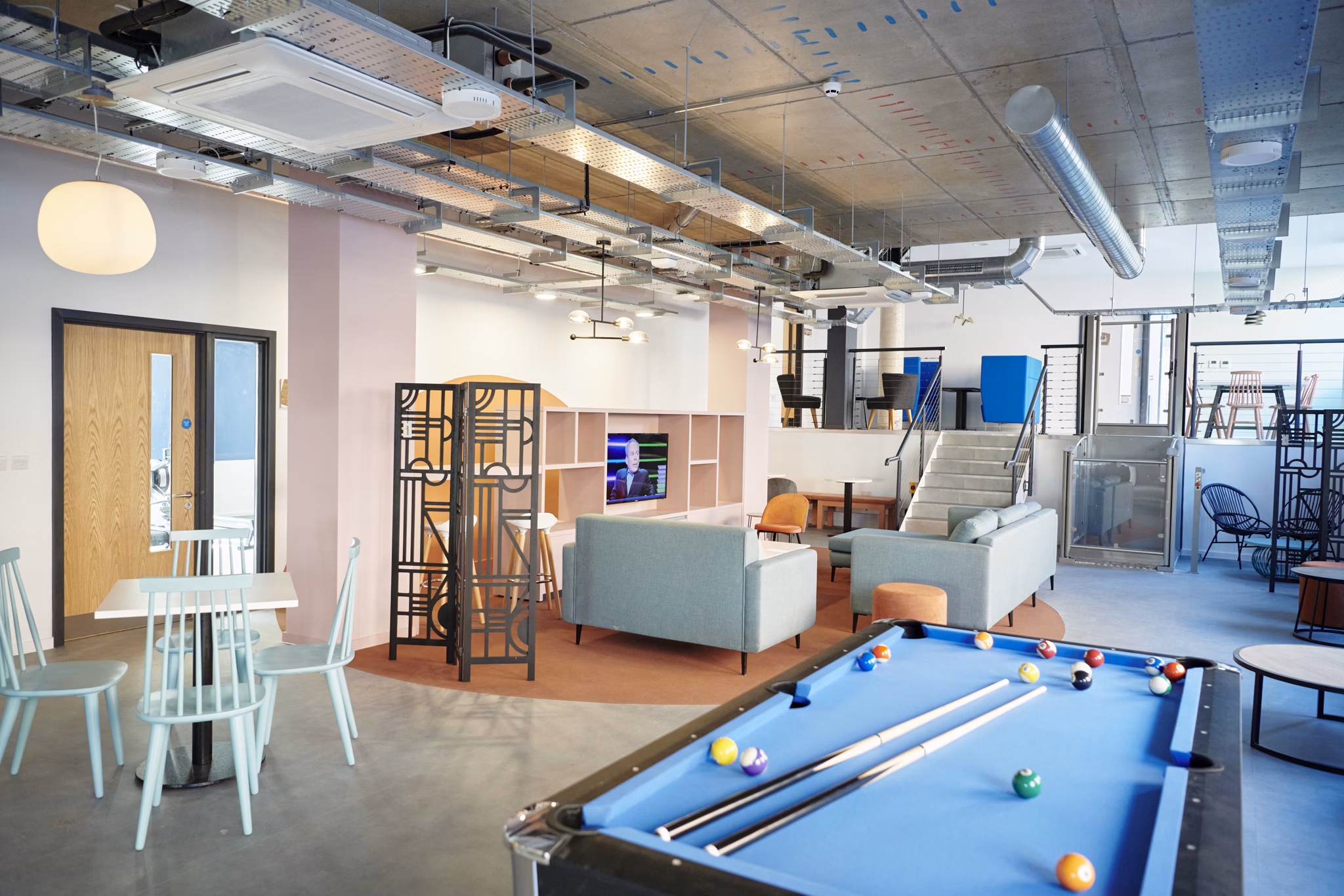 Modern common lounge at Canvas Bristol featuring a pool table, comfortable seating, and a casual atmosphere.