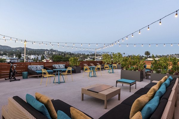 Spacious rooftop deck with seating and city views at Vue Los Feliz Apartments