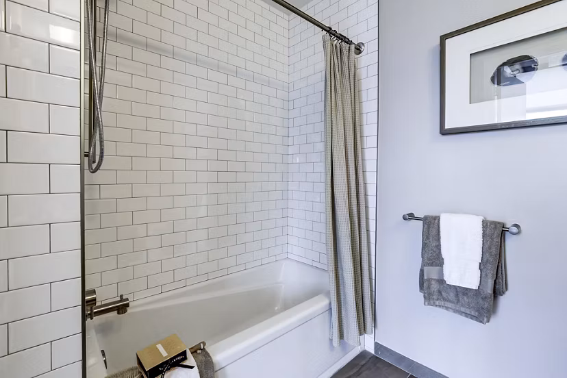 Modern bathroom with sleek fixtures and stylish vanity at Brookland Press Apartments