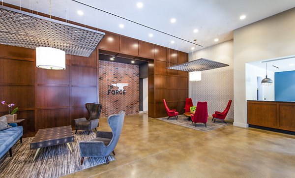 Modern clubhouse with stylish lobby at Brookland Press Apartments in Washington, DC featuring contemporary seating and decor