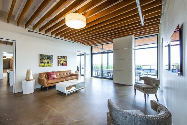Welcoming clubhouse lobby with modern decor at Brookland Press Apartments, featuring comfortable seating and stylish interior design