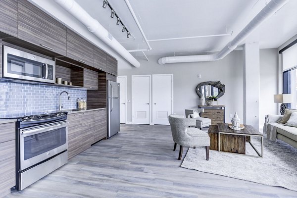 Dining room with modern furnishings and industrial design at Brookland Press Apartments