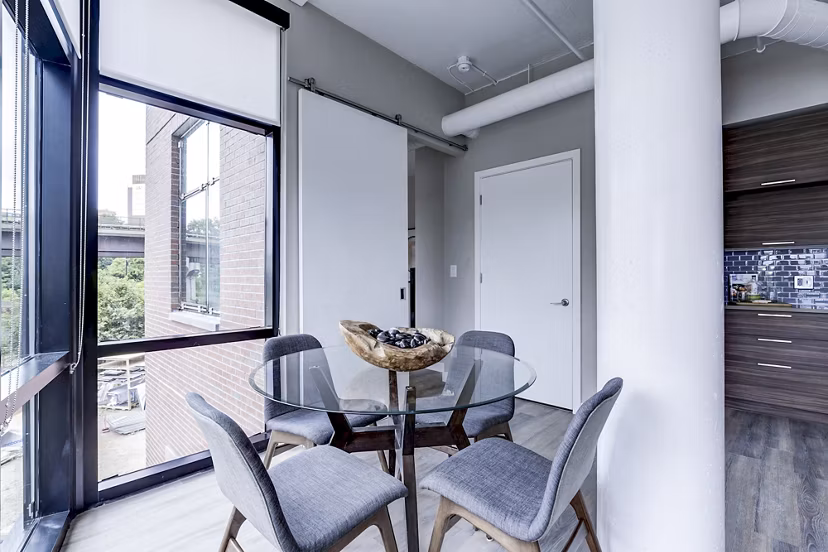 Dining room with modern decor and sleek furniture at Brookland Press Apartments