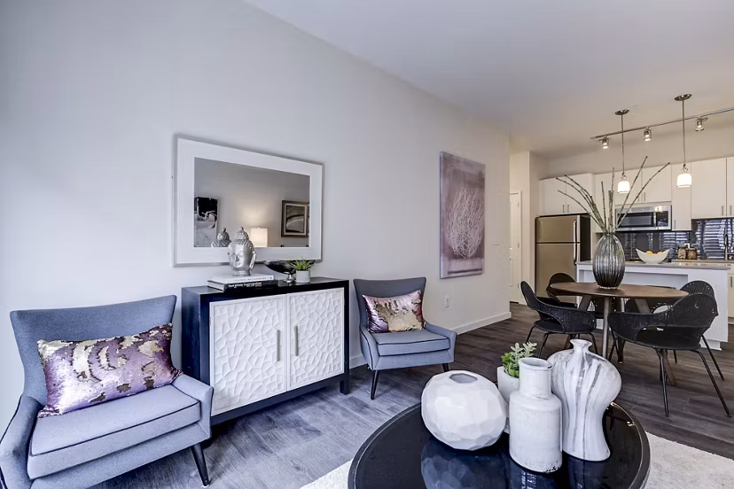 Contemporary living room featuring stylish furniture and artwork at Brookland Press Apartments in Washington, DC