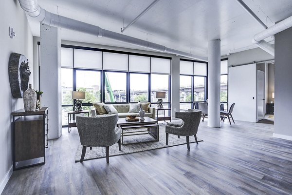 Modern living room with stylish furnishings at Brookland Press Apartments