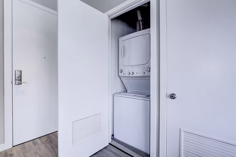 Laundry room featuring modern washers and dryers at Brookland Press Apartments, Greystar luxury apartments in Washington, DC