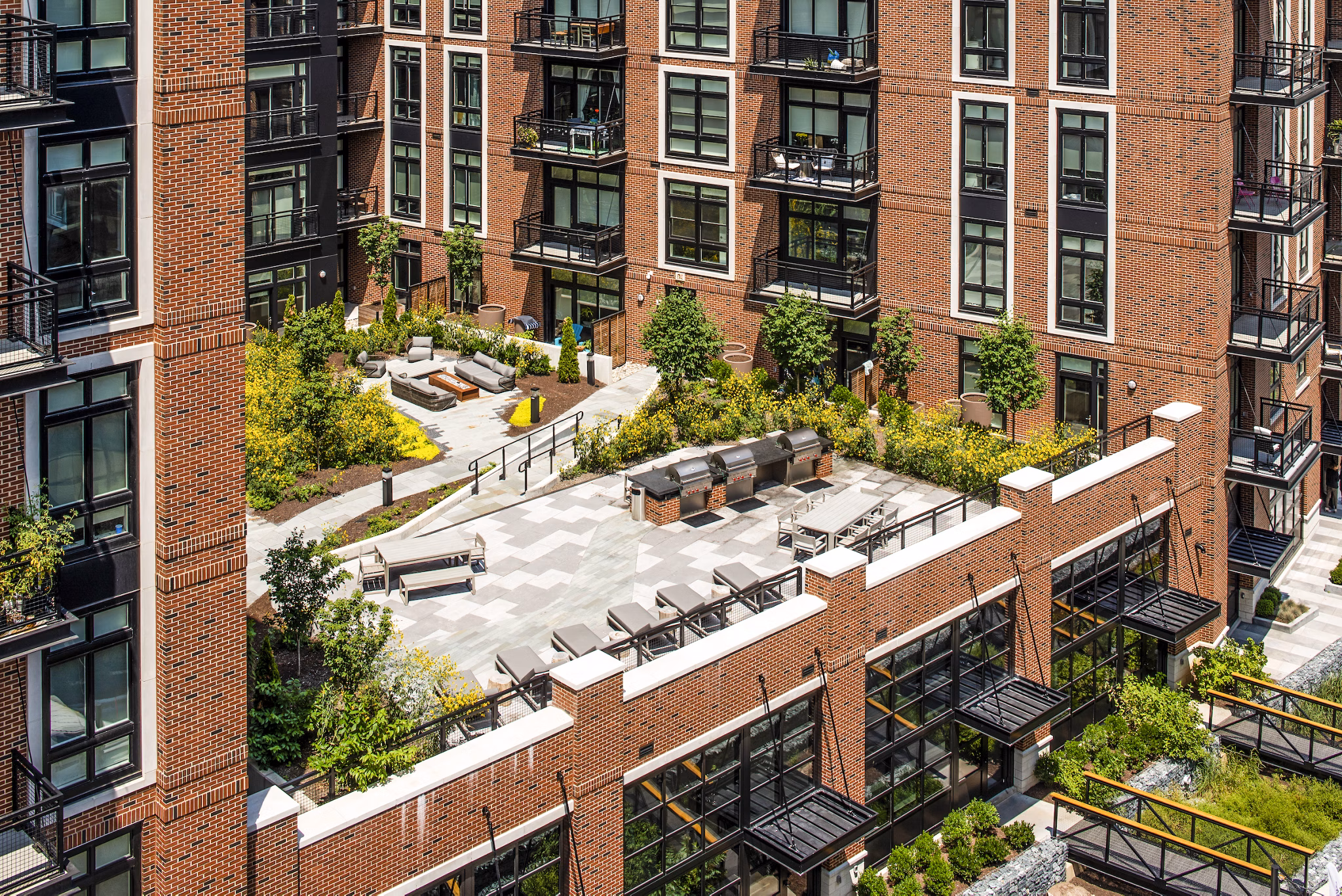 Spacious grill area on patio balcony at Brookland Press Apartments