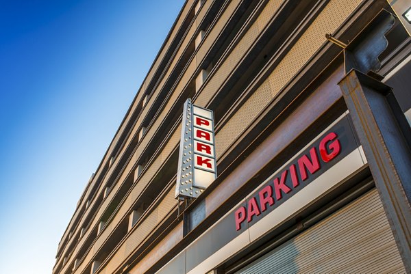 Spacious garage with secure covered parking at Hecht Warehouse Apartments, offering convenience and protection for residents' vehicles