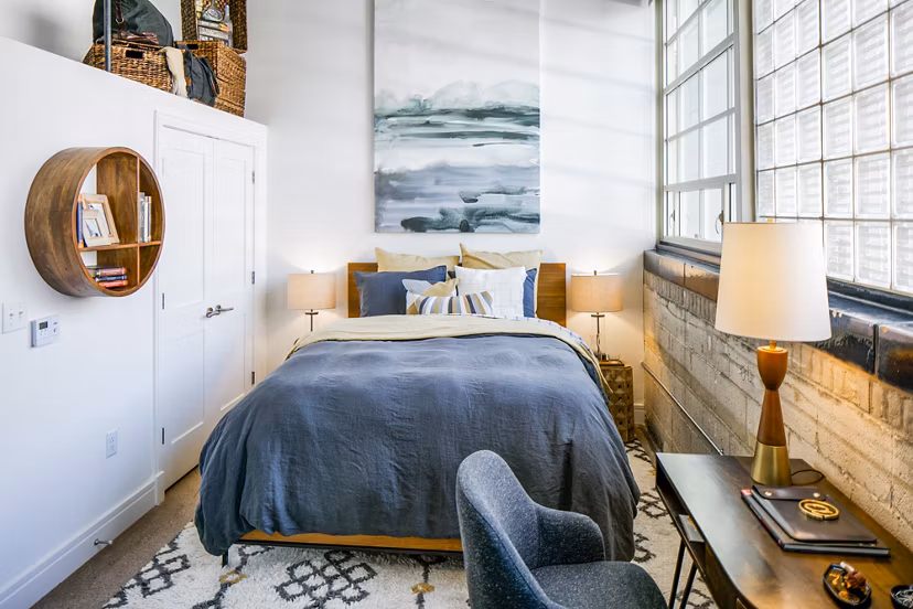 Cozy bedroom with elegant decor at Hecht Warehouse Apartments, Greystar luxury apartments
