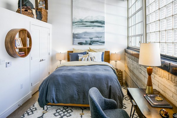 Cozy bedroom with elegant decor at Hecht Warehouse Apartments, Greystar luxury apartments
