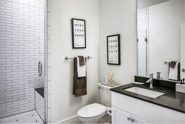 Elegant bathroom featuring marble countertops at Hecht Warehouse Apartments