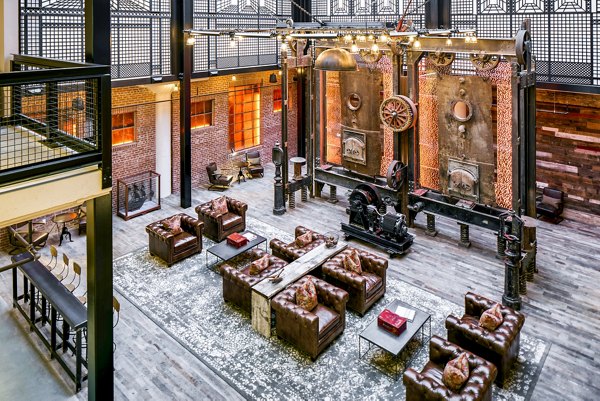 Clubhouse with modern decor and seating at Hecht Warehouse Apartments