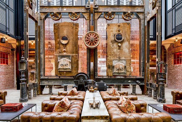 Modern clubhouse with cozy seating and vibrant decor at Hecht Warehouse Apartments