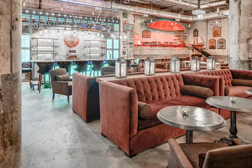 Clubhouse with modern decor and seating at Hecht Warehouse Apartments, luxury living environment
