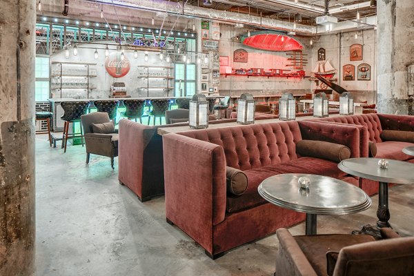 Clubhouse with modern decor and seating at Hecht Warehouse Apartments, luxury living environment