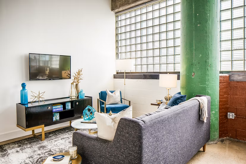 Spacious living room with industrial design at Hecht Warehouse Apartments